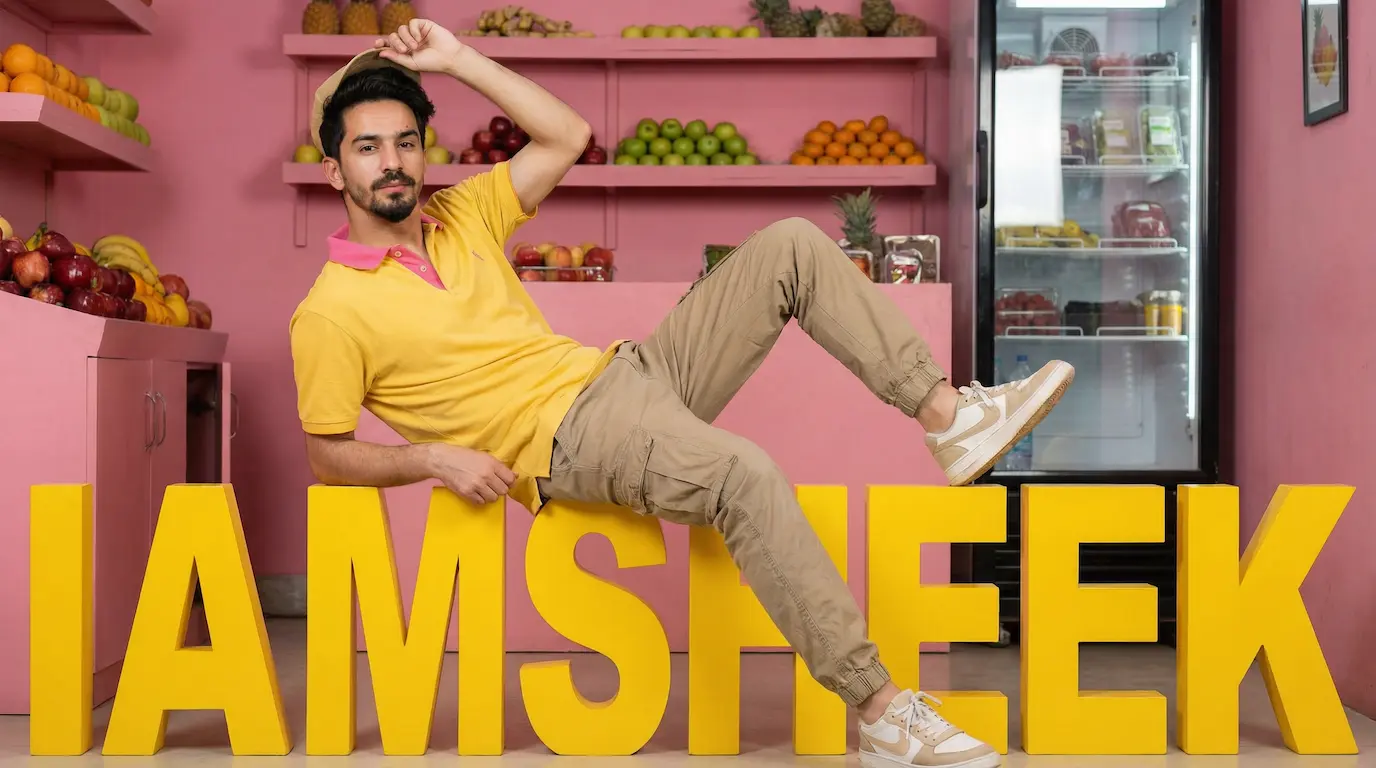 Man in yellow polo and khaki cargo pants sitting dynamically on large 3D yellow "IAMSHEEK" letters in vibrant magenta fruit shop studio, professional studio lighting, photorealistic detail.